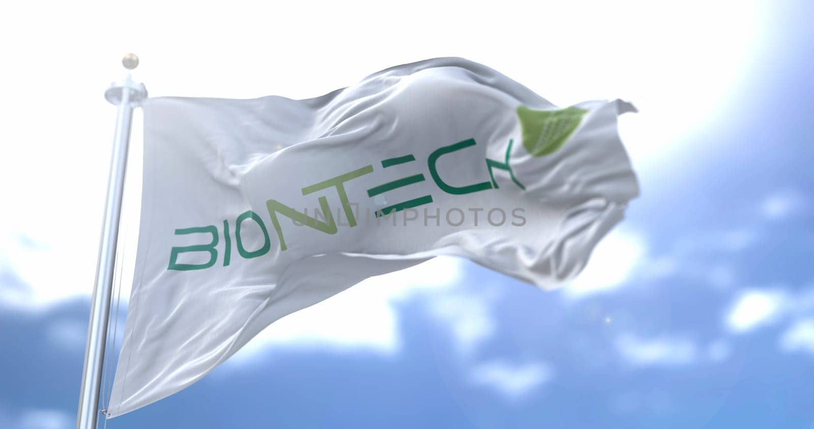 Rome, Italy, January 26, 2021: White flag with the Biontech logo waving in the wind. Biontech is an german pharmaceutical company that has produced a vaccine for the Covid-19 coronavirus