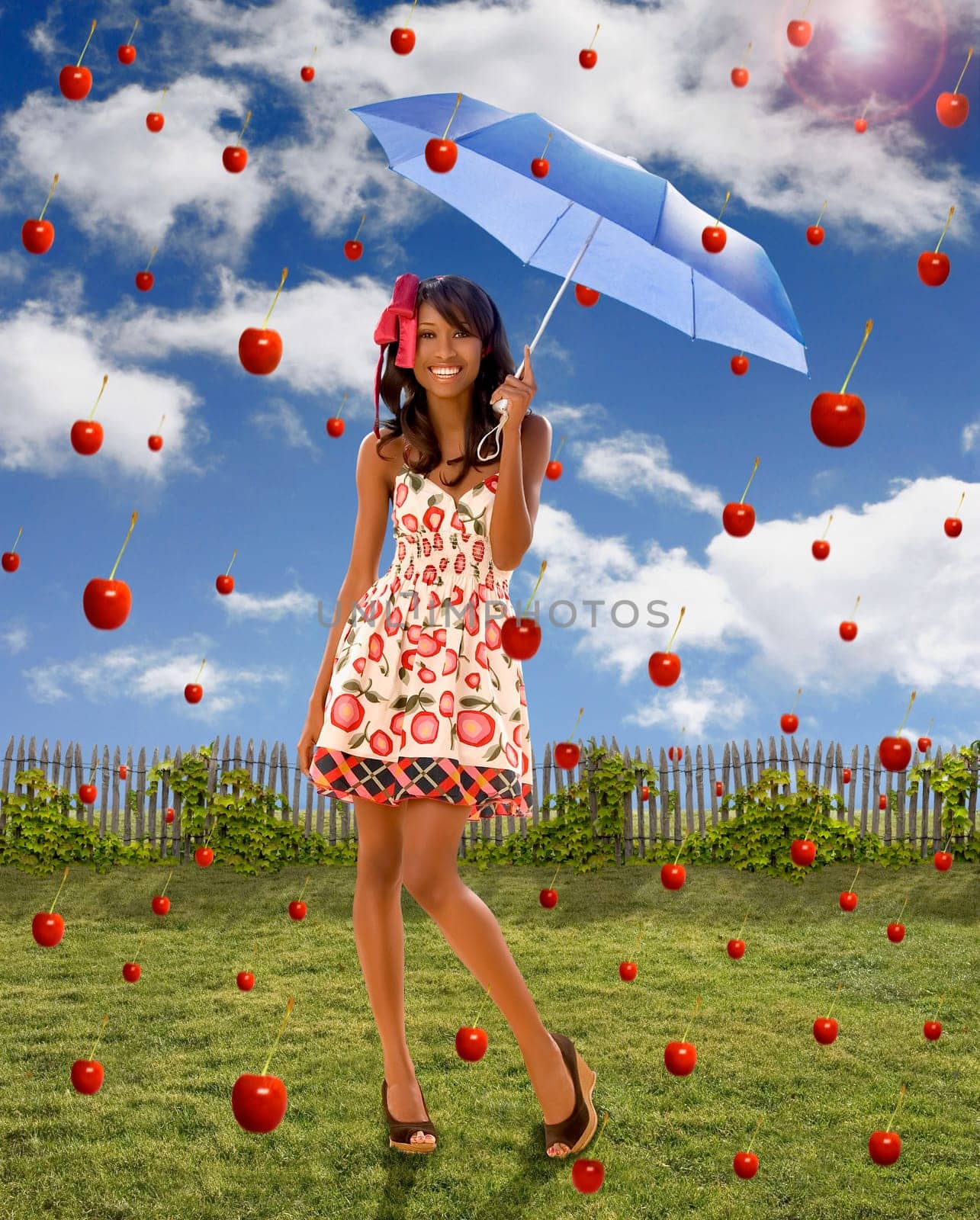 Young woman holding an umbrella under falling apples