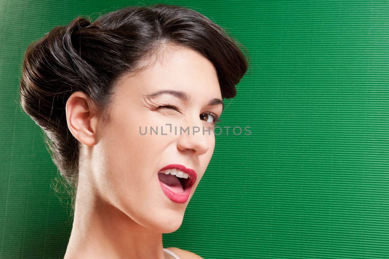 Close_up of a woman winking