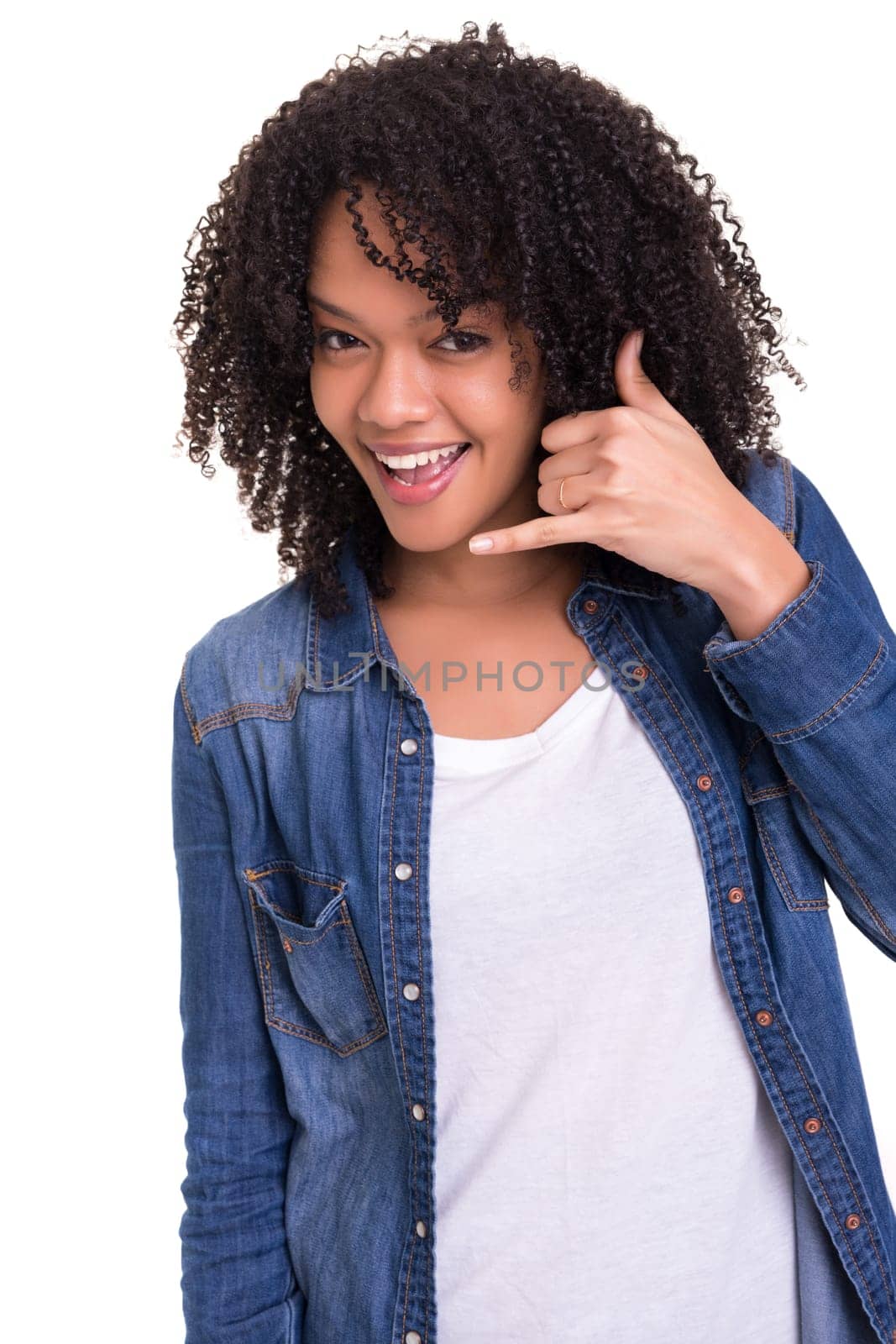 Happy young african woman student making "call me"" sign with hand"