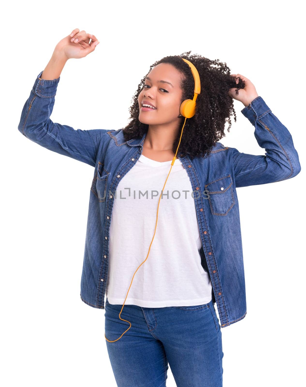 Beautiful young african woman listening to music, isolated over white