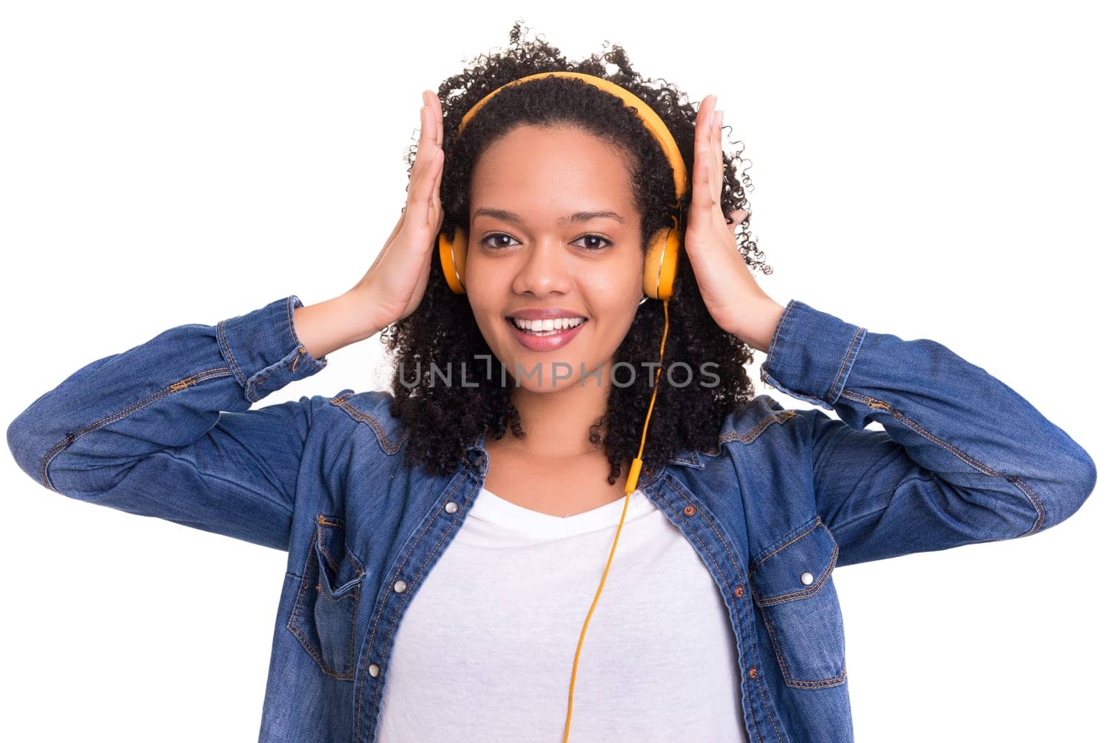 Beautiful young african woman listening to music, isolated over white