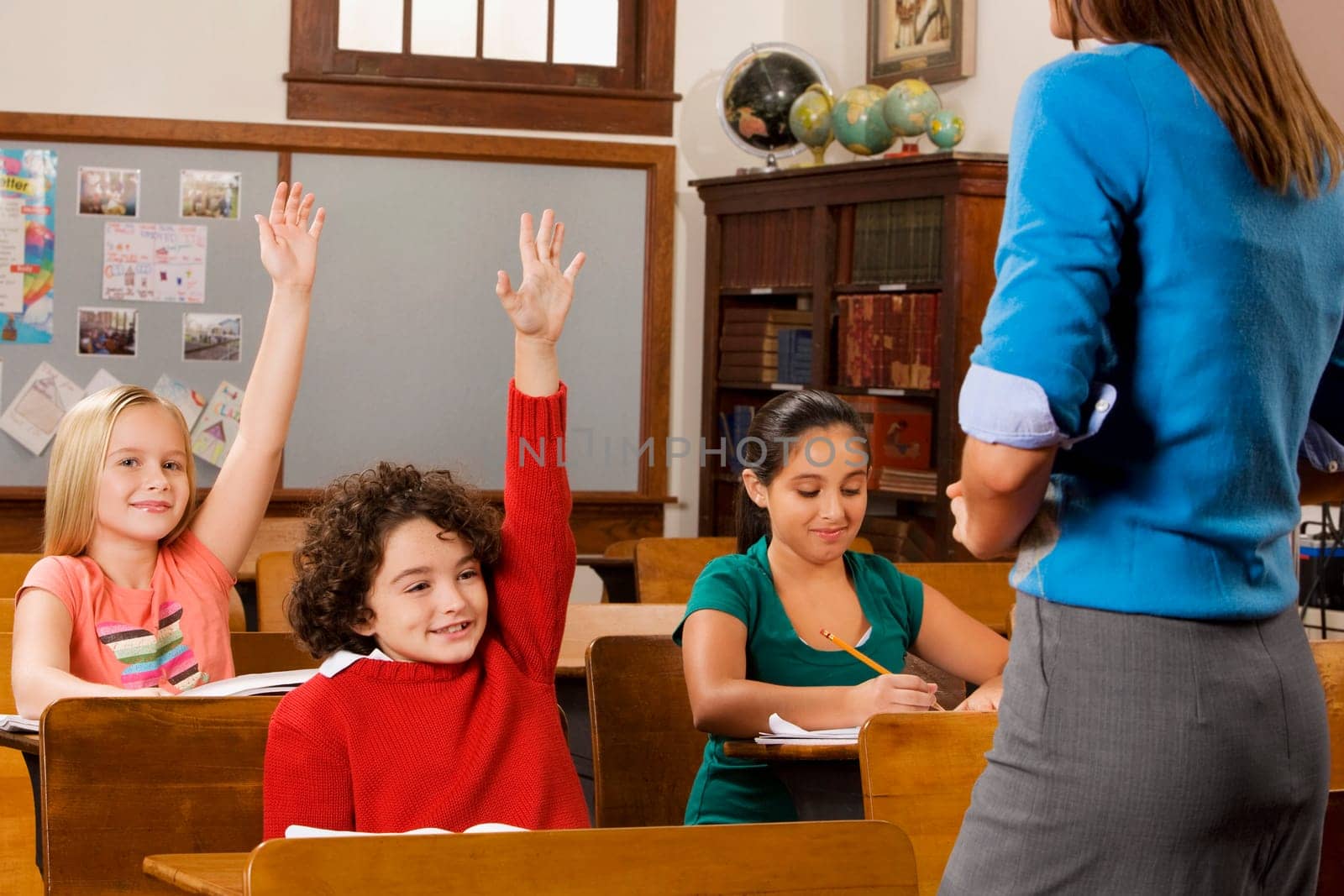Students with their teacher in a classroom