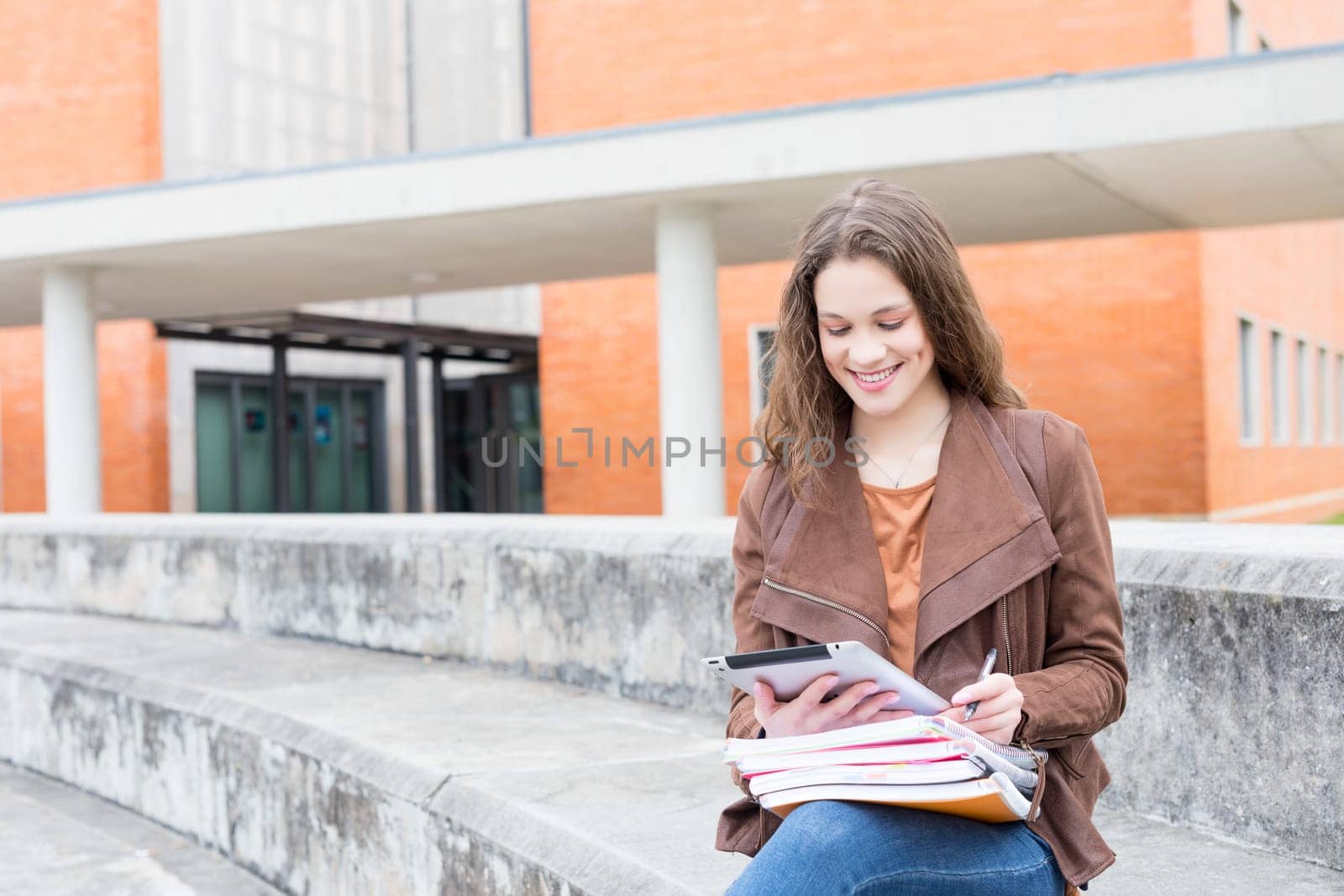 Happy young student at the university campus