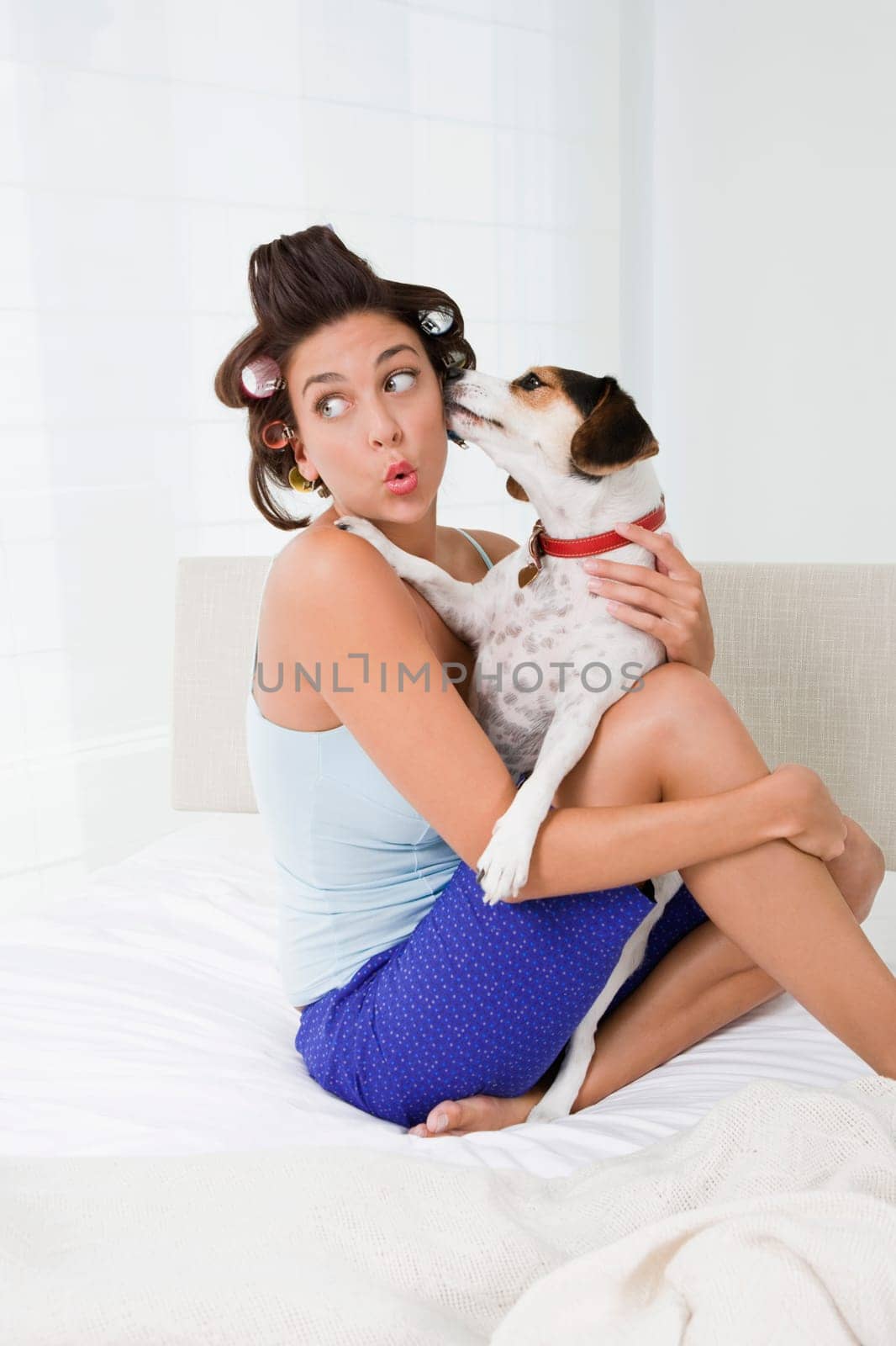 Young woman holding a puppy