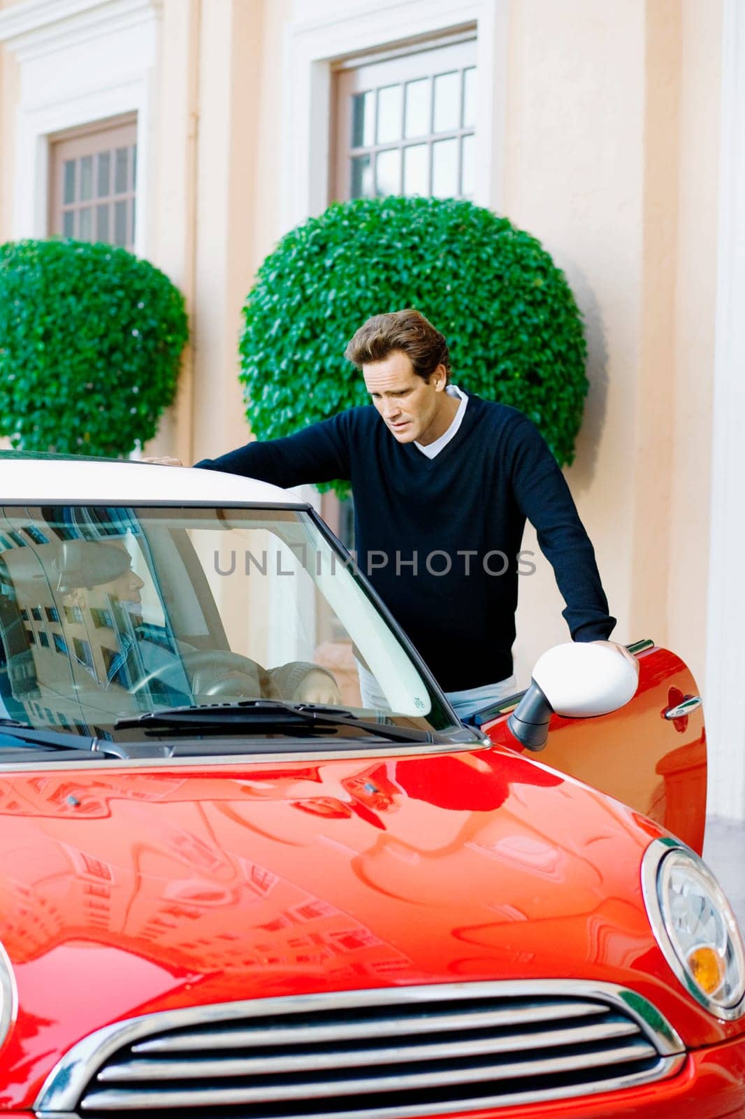 Man standing near a car, Biltmore Hotel, Coral Gables, Florida, USA