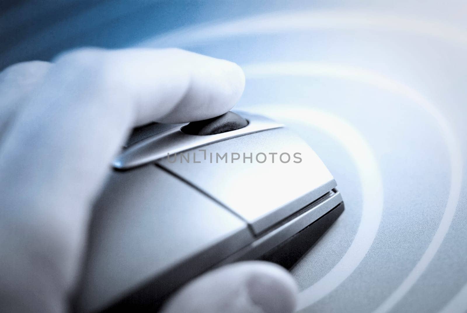 Close_up of a human hand holding a computer mouse