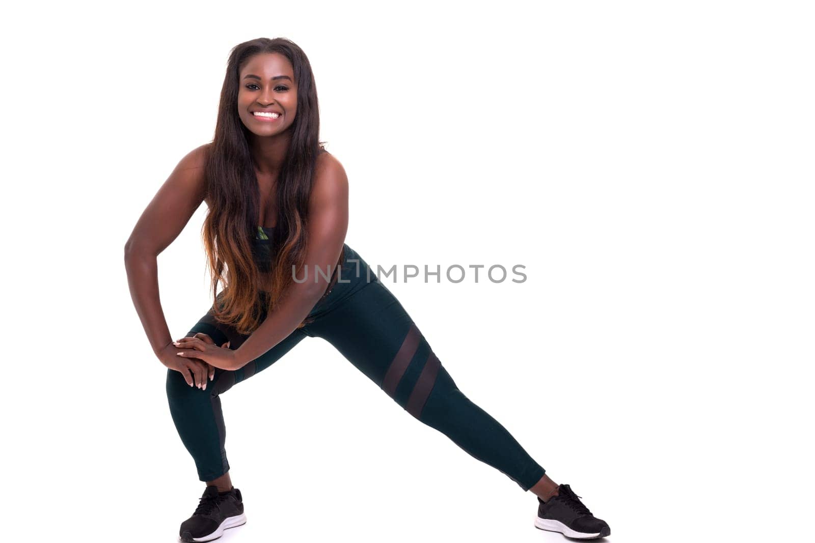 Beautiful large african woman doing exercise - Isolated over white
