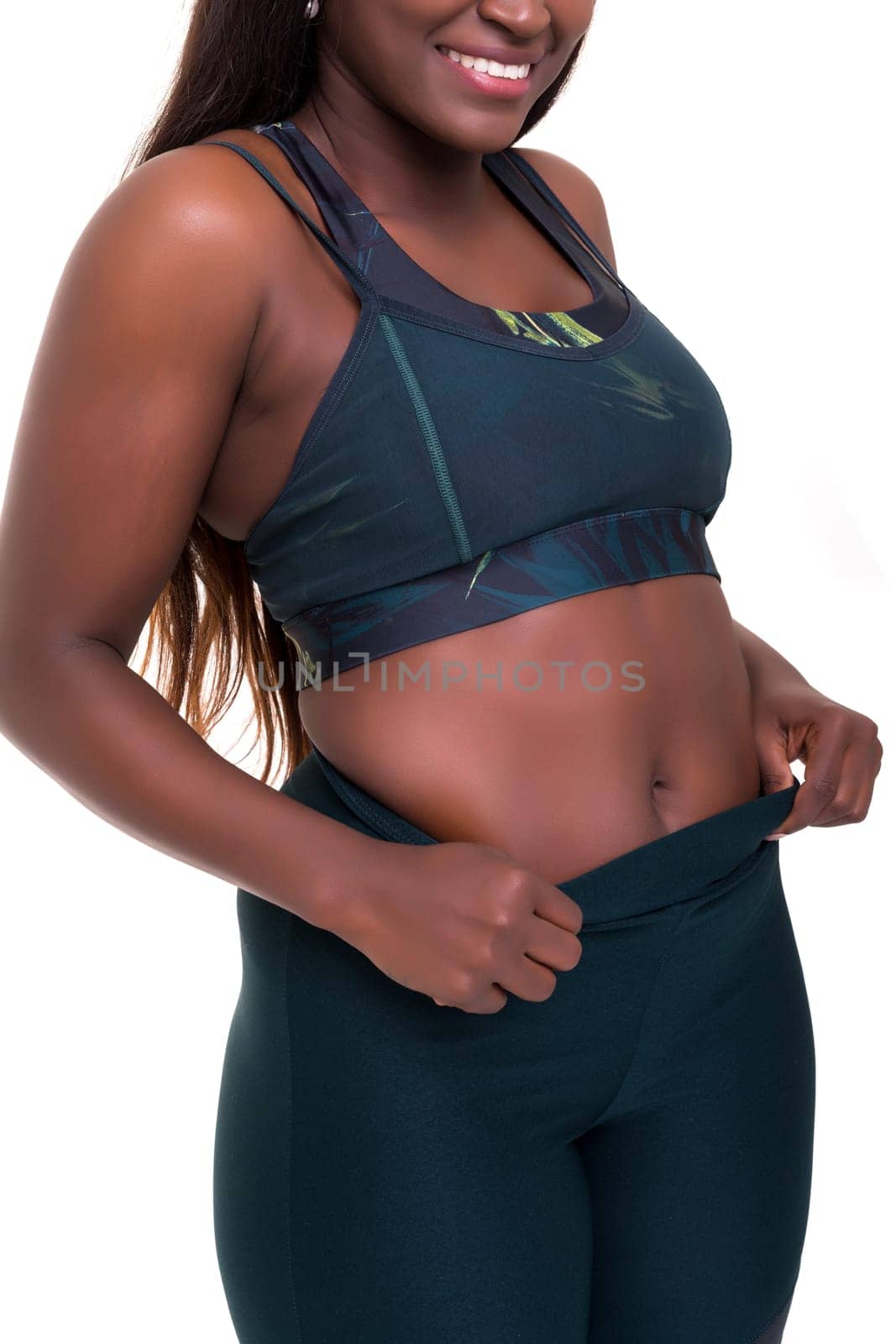 Beautiful large african woman doing exercise - Isolated over white