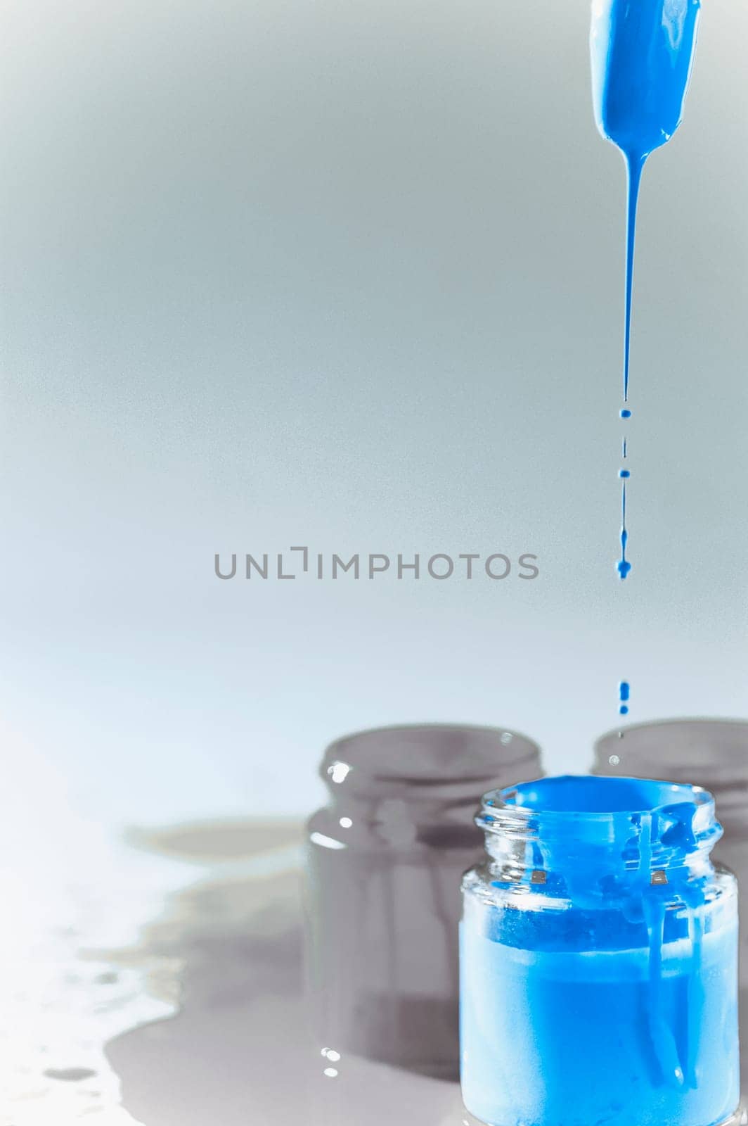 Paint dripping from a paintbrush