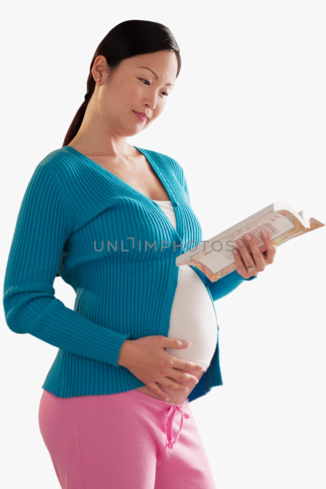 Pregnant woman reading a book