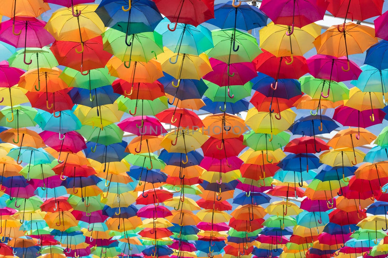 Lots of umbrellas coloring the sky in the city of Agueda, Portugal