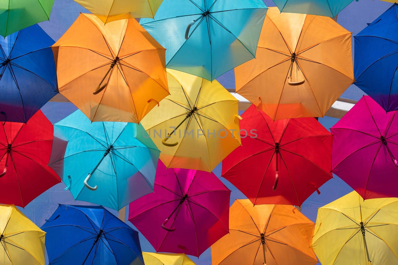 Lots of umbrellas coloring the sky in the city of Agueda, Portugal