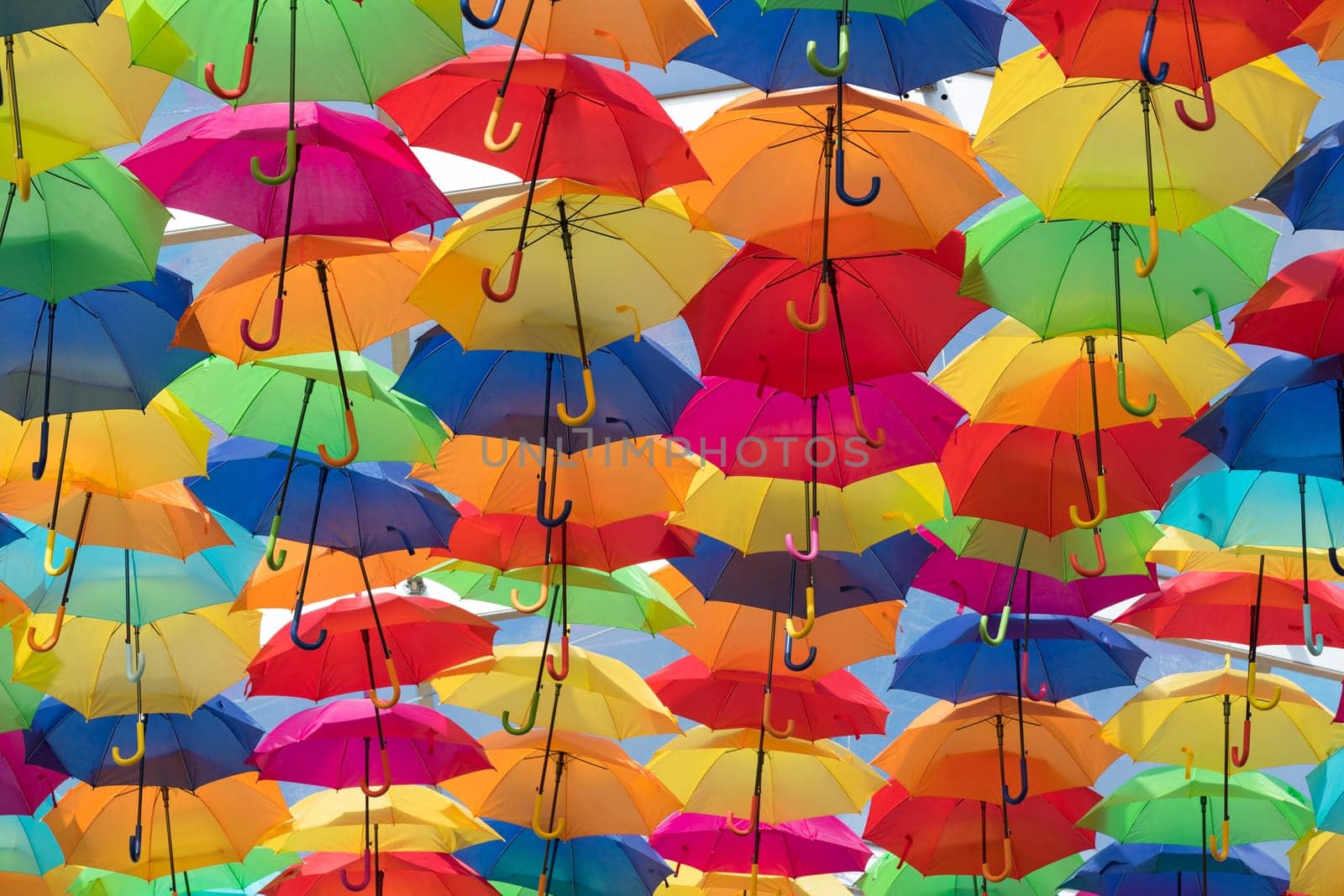 Lots of umbrellas coloring the sky in the city of Agueda, Portugal
