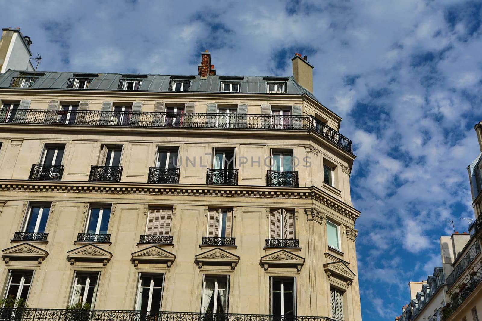 Facade of a traditional living building in Paris, France