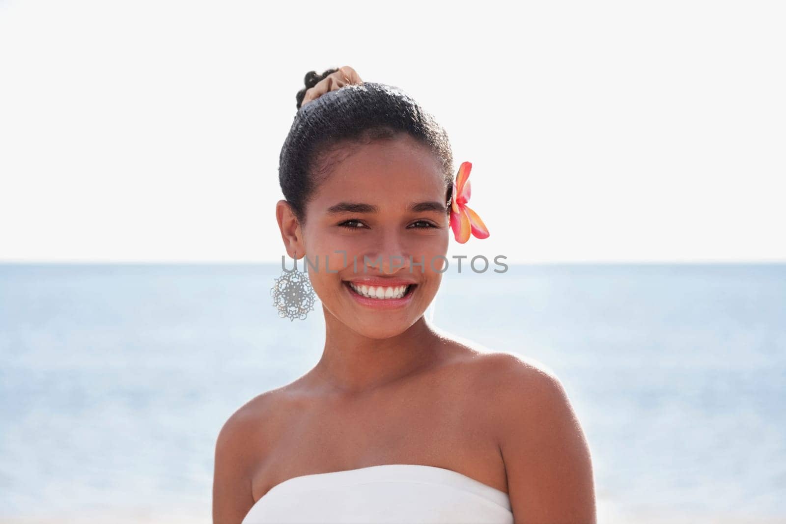 Portrait of a teenage girl smiling on the beach