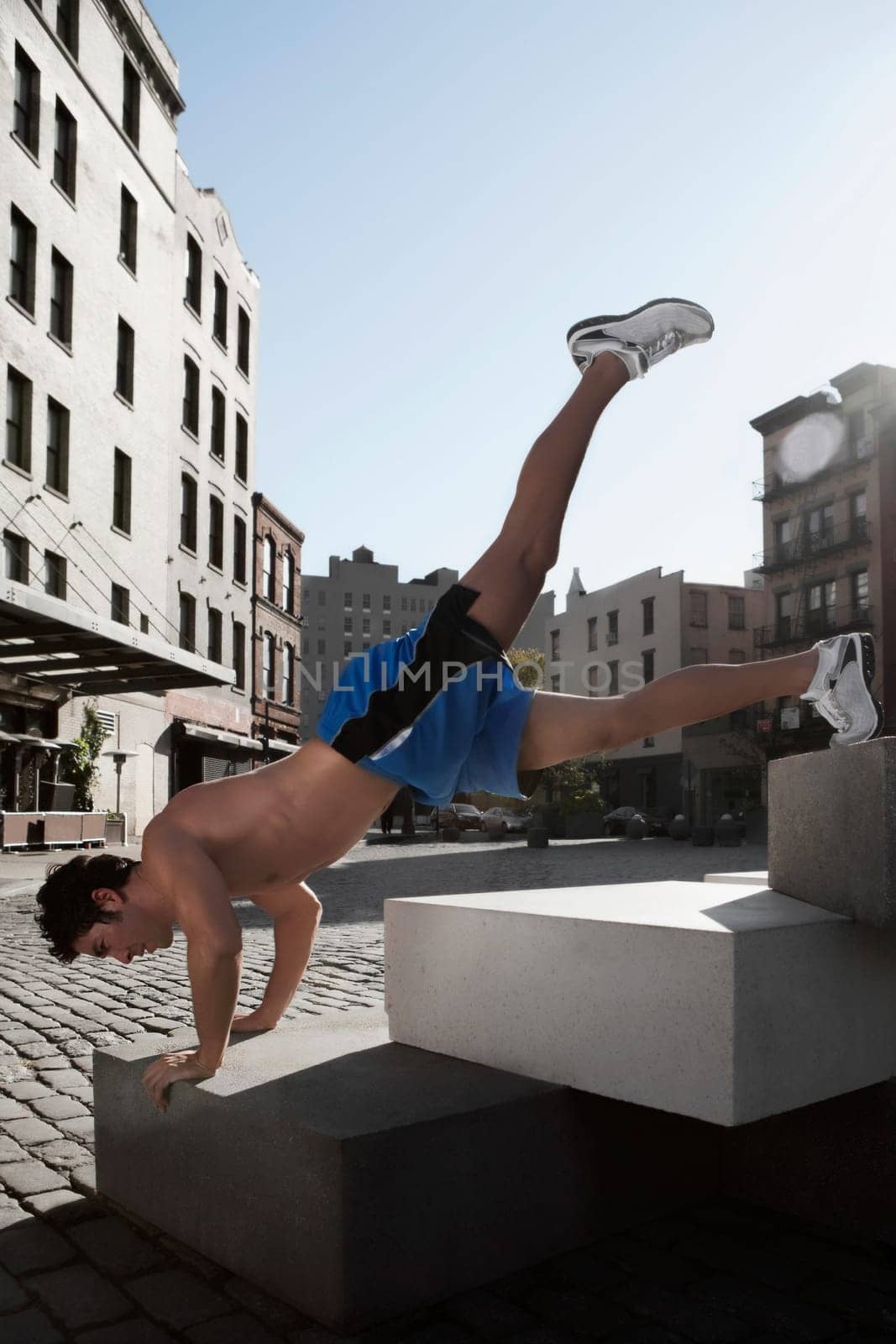 Man exercising on stones