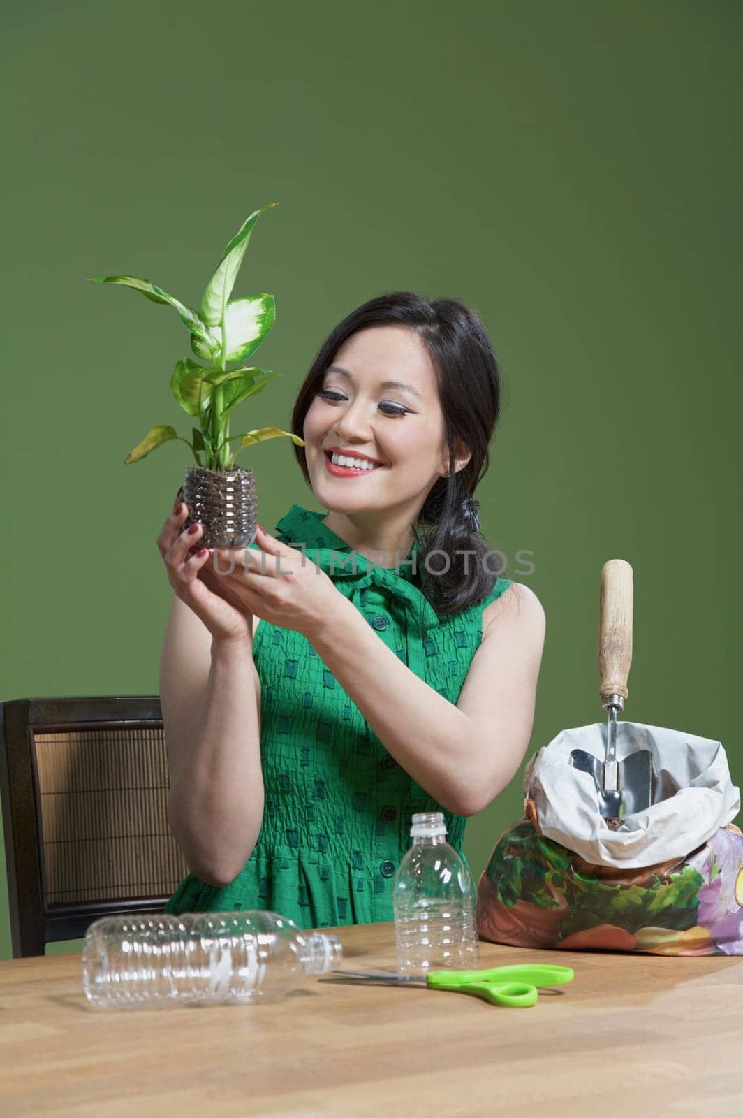 Woman holding a seedling