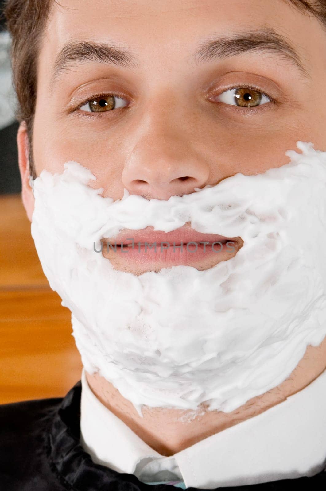Man getting shaved in a salon