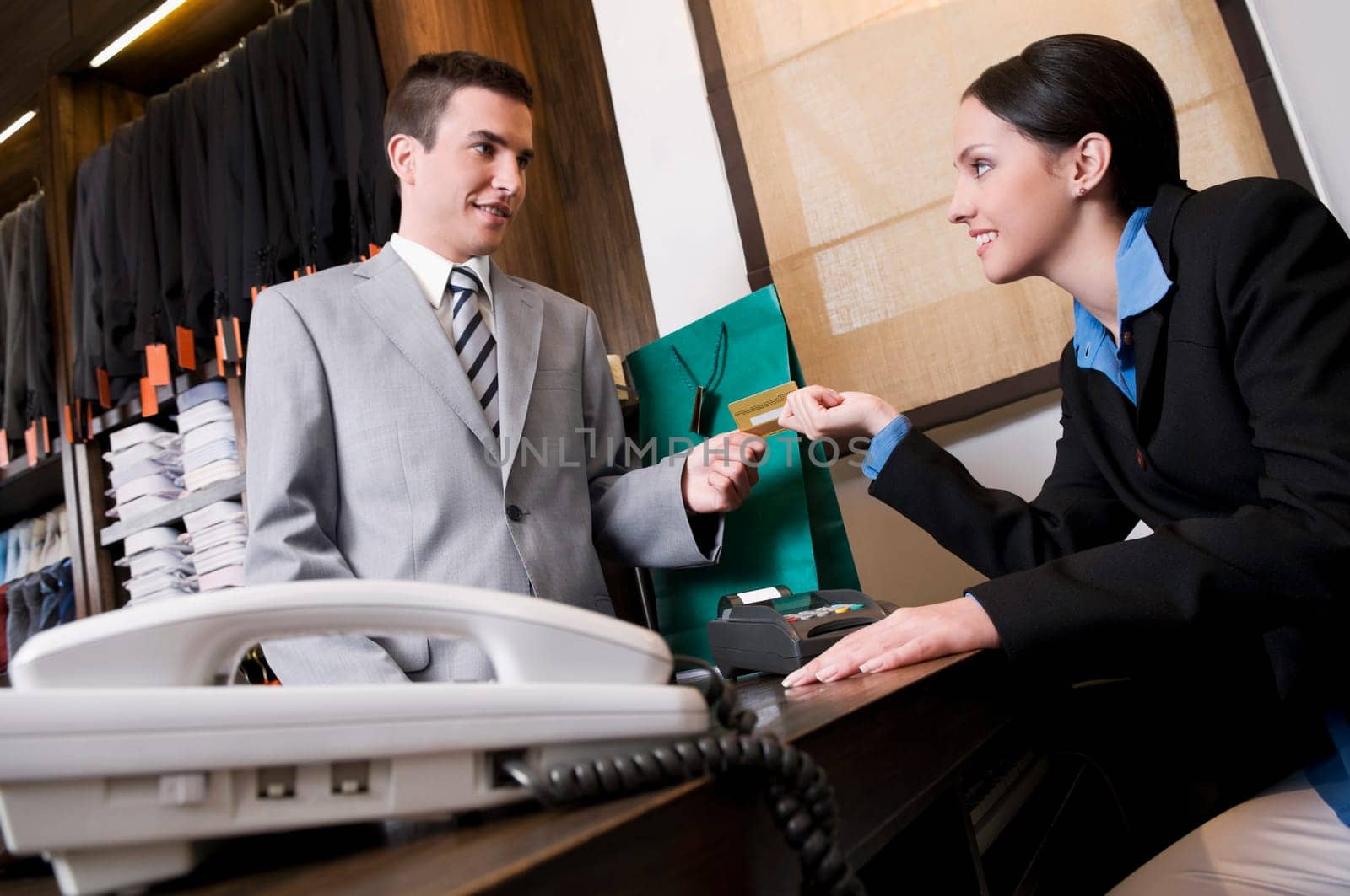 Businessman paying by a credit card in a store