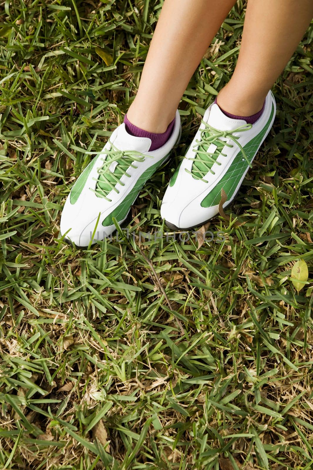 Low section view of a teenage girl wearing golf shoes, Biltmore Golf Course, Coral Gables, Florida, USA