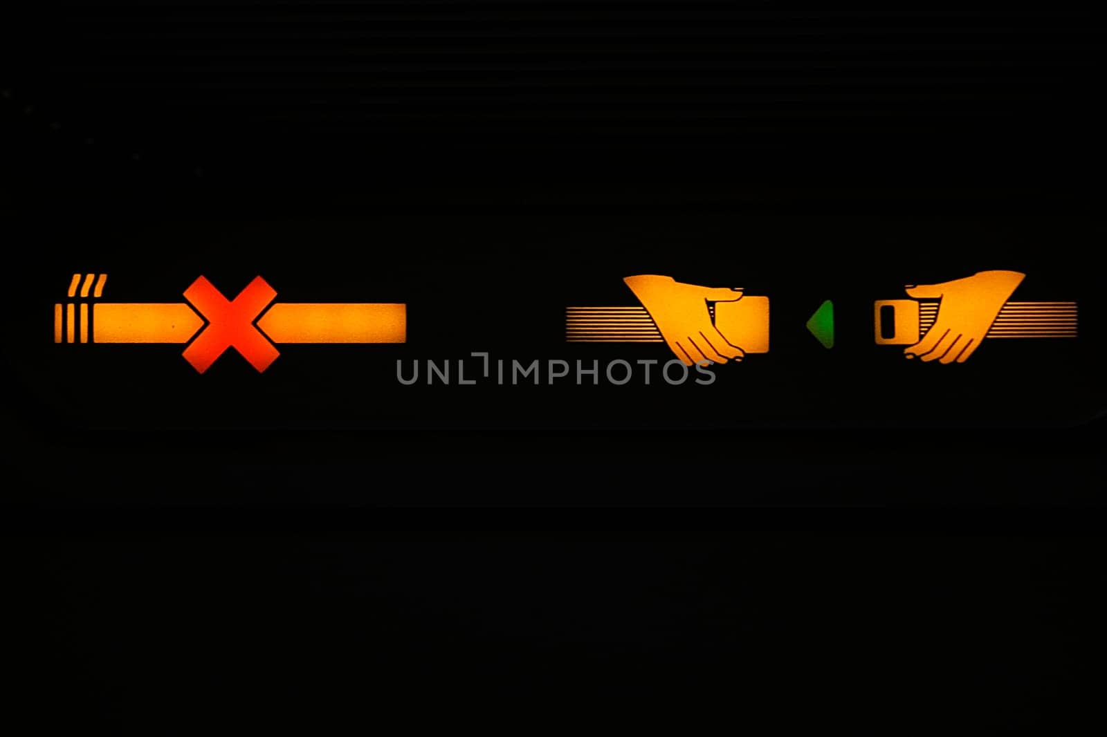Close_up of a No Smoking and Fasten Seatbelt signs