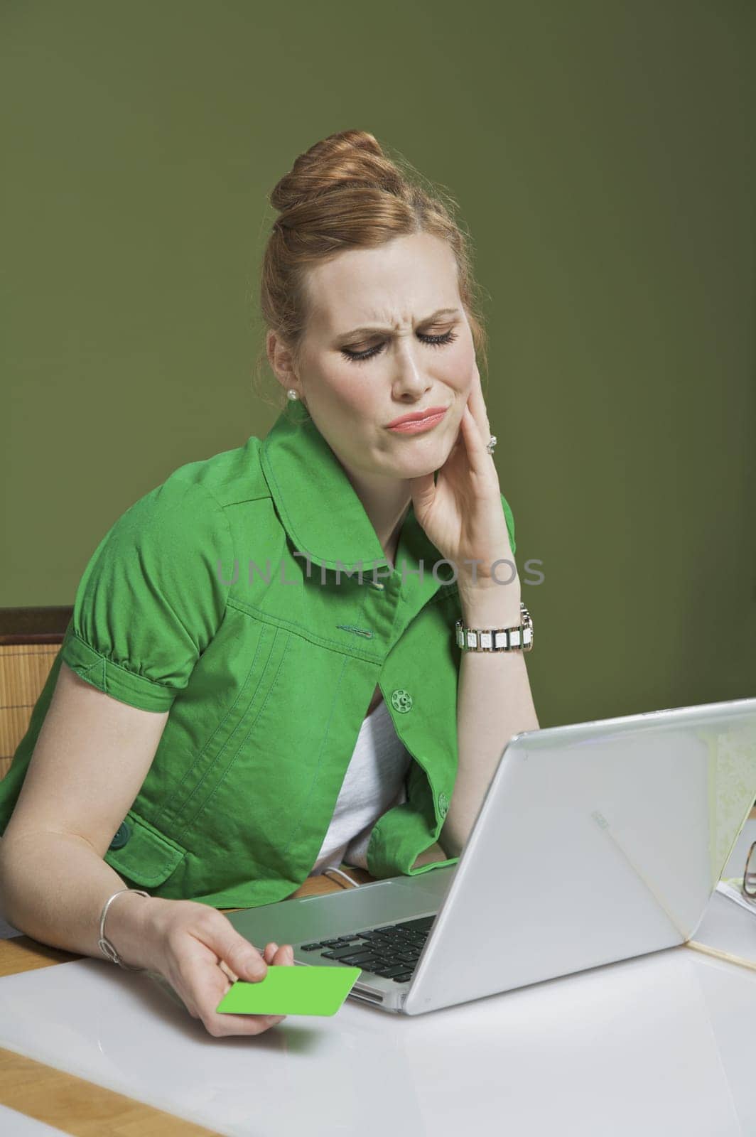 Businesswoman looking at a laptop in the office