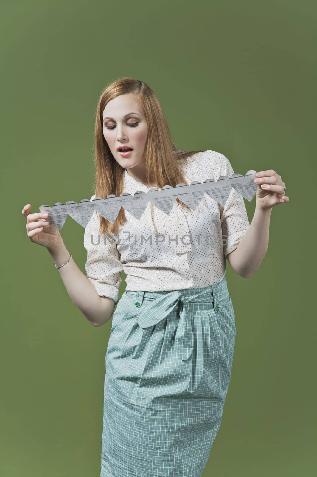Woman holding a heart shaped paper chain