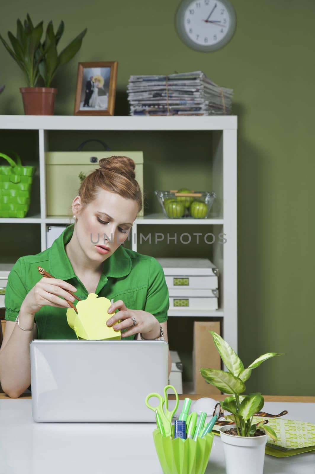 Businesswoman in the office opening packaged food