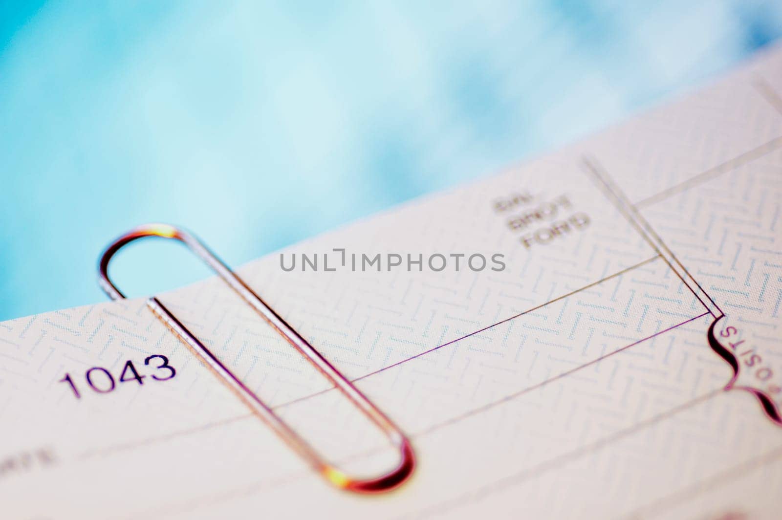 Close_up of a check with a paper clip