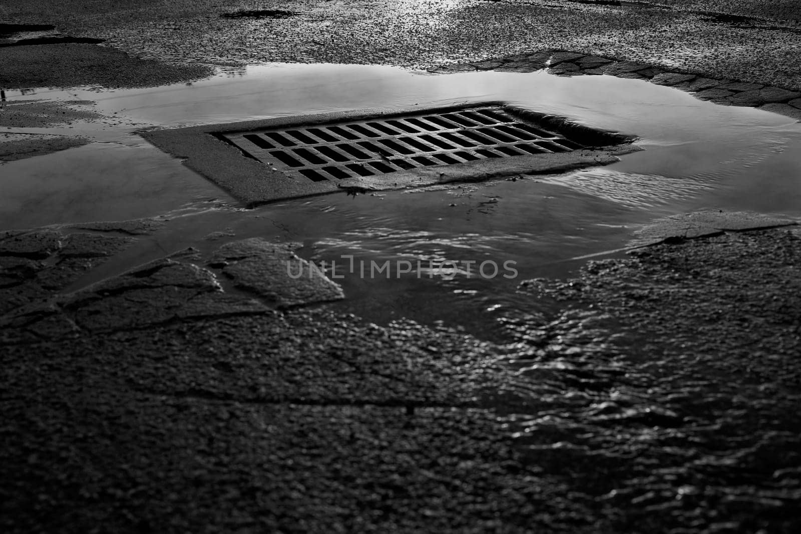 High angle view of a sewer drain after rain