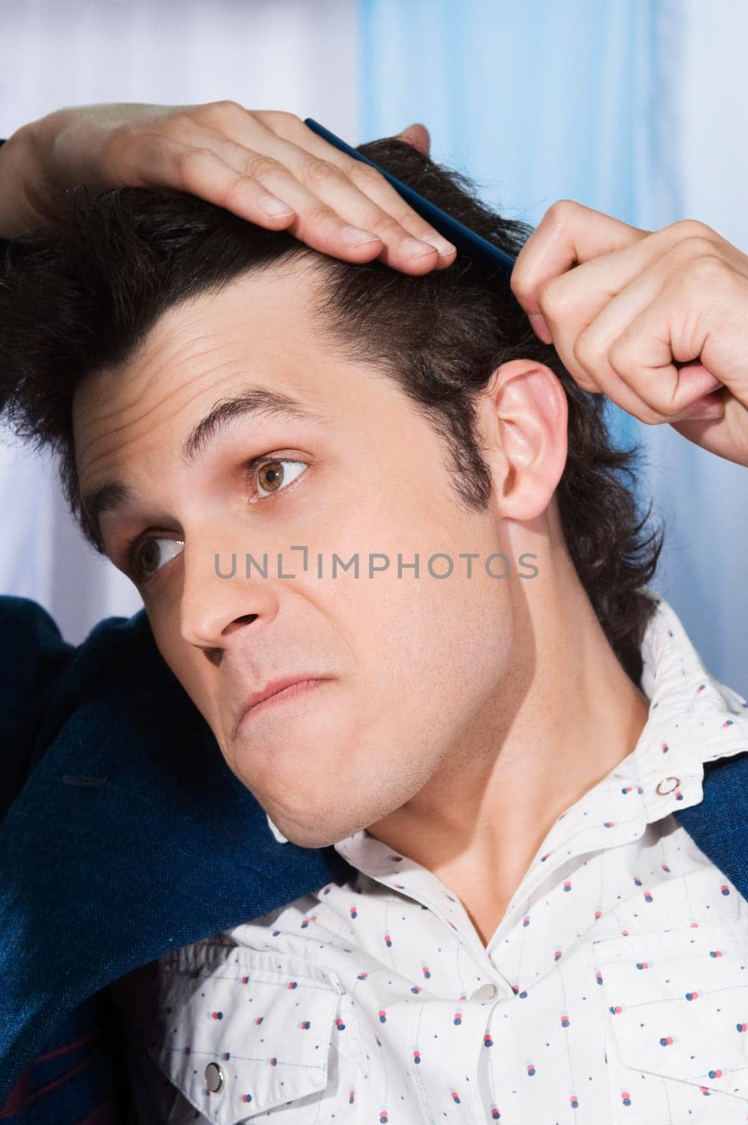 Man combing his hair