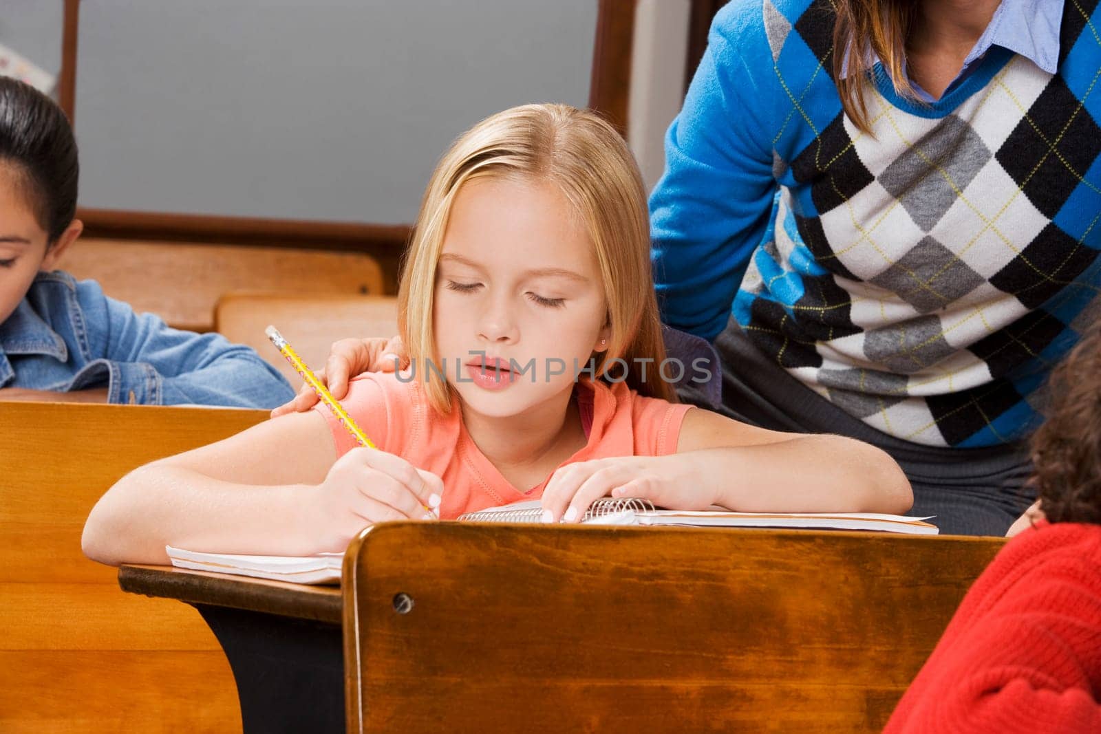 Students with their teacher in a classroom