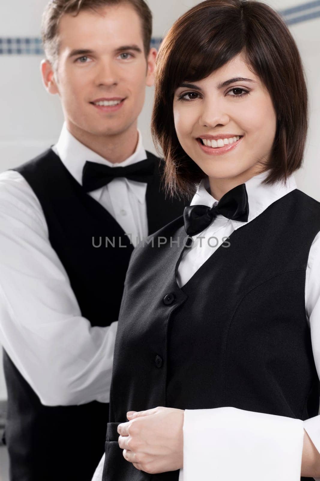 Portrait of two waiters in a restaurant
