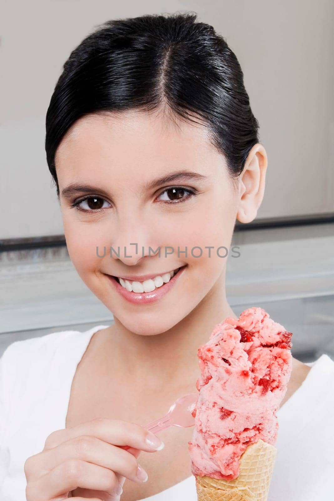 Teenage girl holding an ice cream