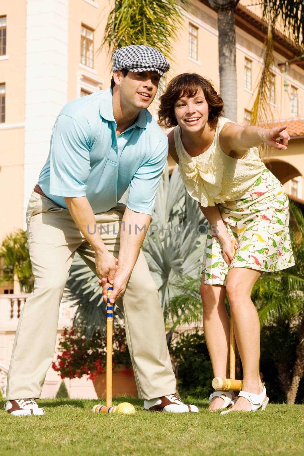 Couple playing croquet in a hotel lawn, Biltmore Hotel, Coral Gables, Florida, USA
