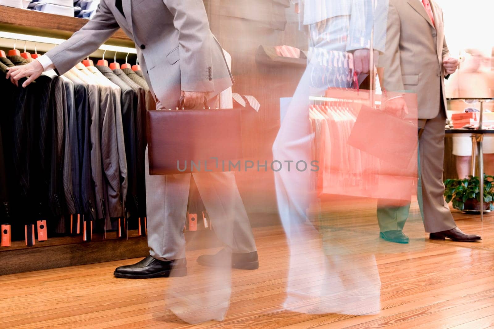 Businessman and a woman shopping in a clothing store