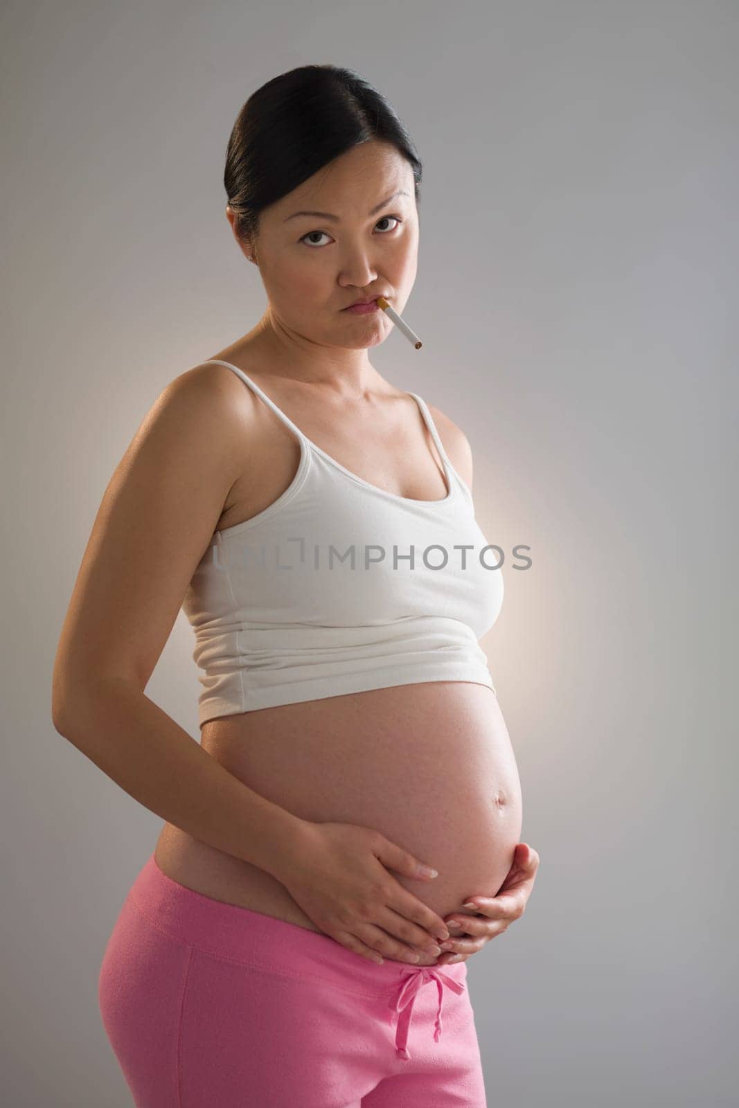 Pregnant woman smoking a cigarette