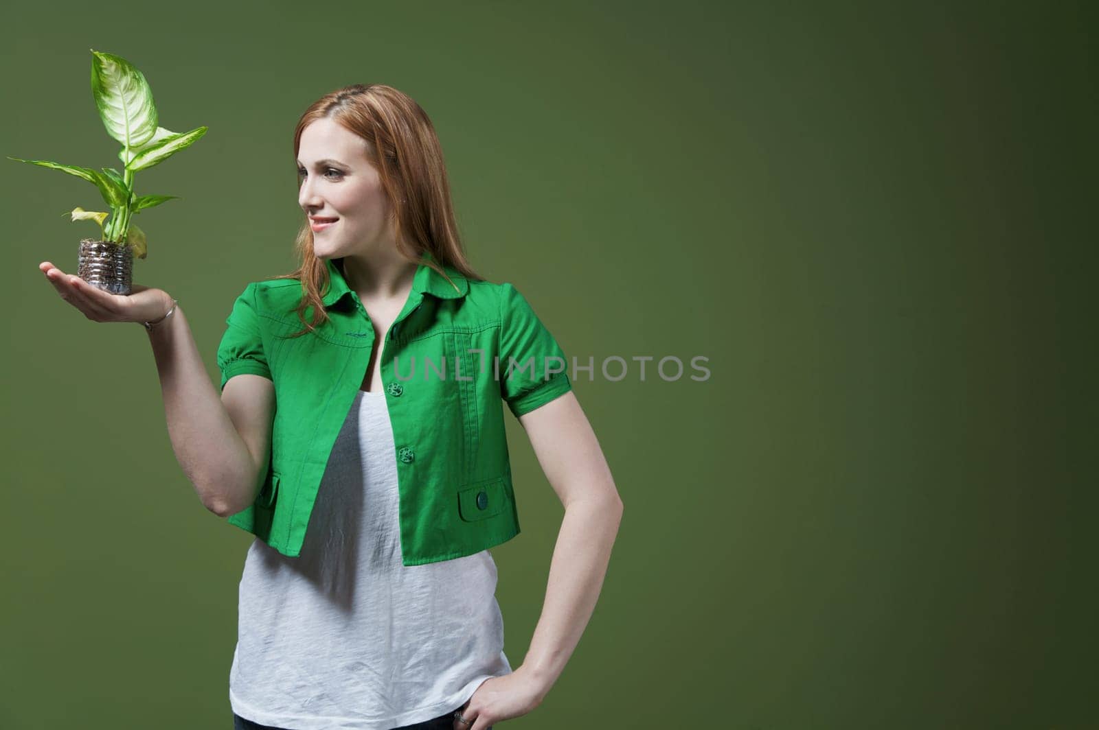 Woman looking at a seedling