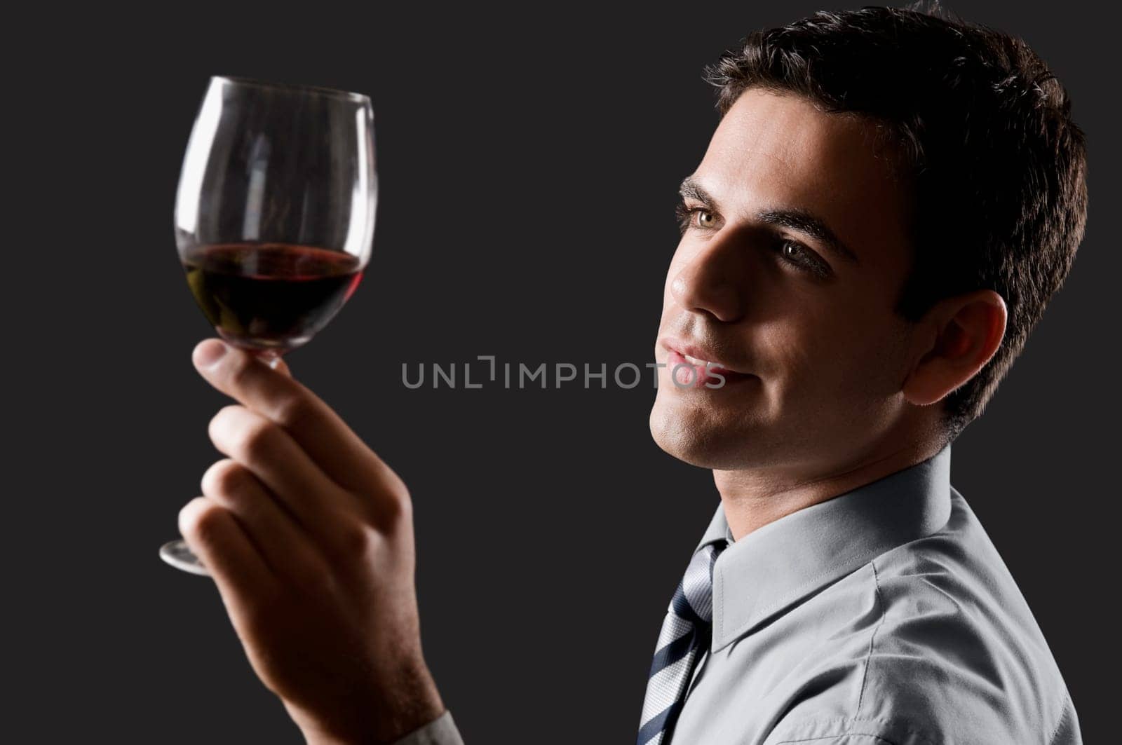 Businessman holding a wine glass