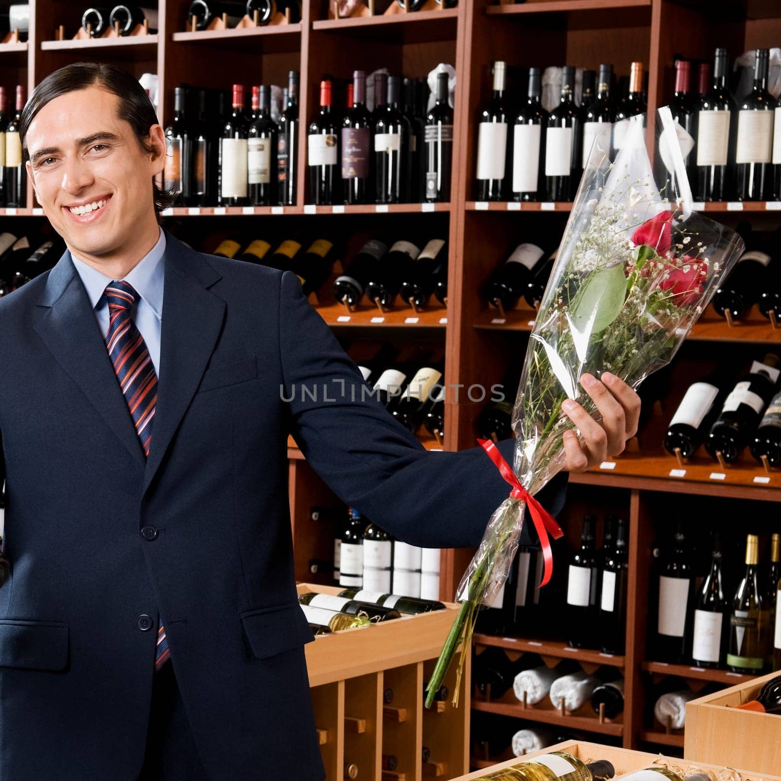 Businessman holding a bouquet of flowers
