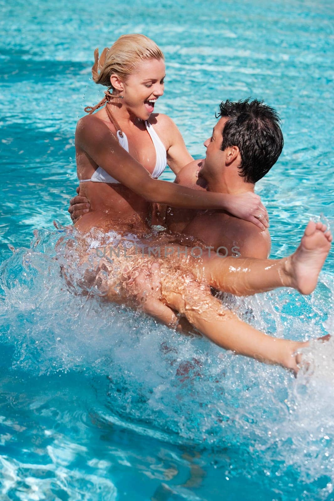 Couple having fun in a swimming pool, Biltmore Hotel, Coral Gables, Florida, USA