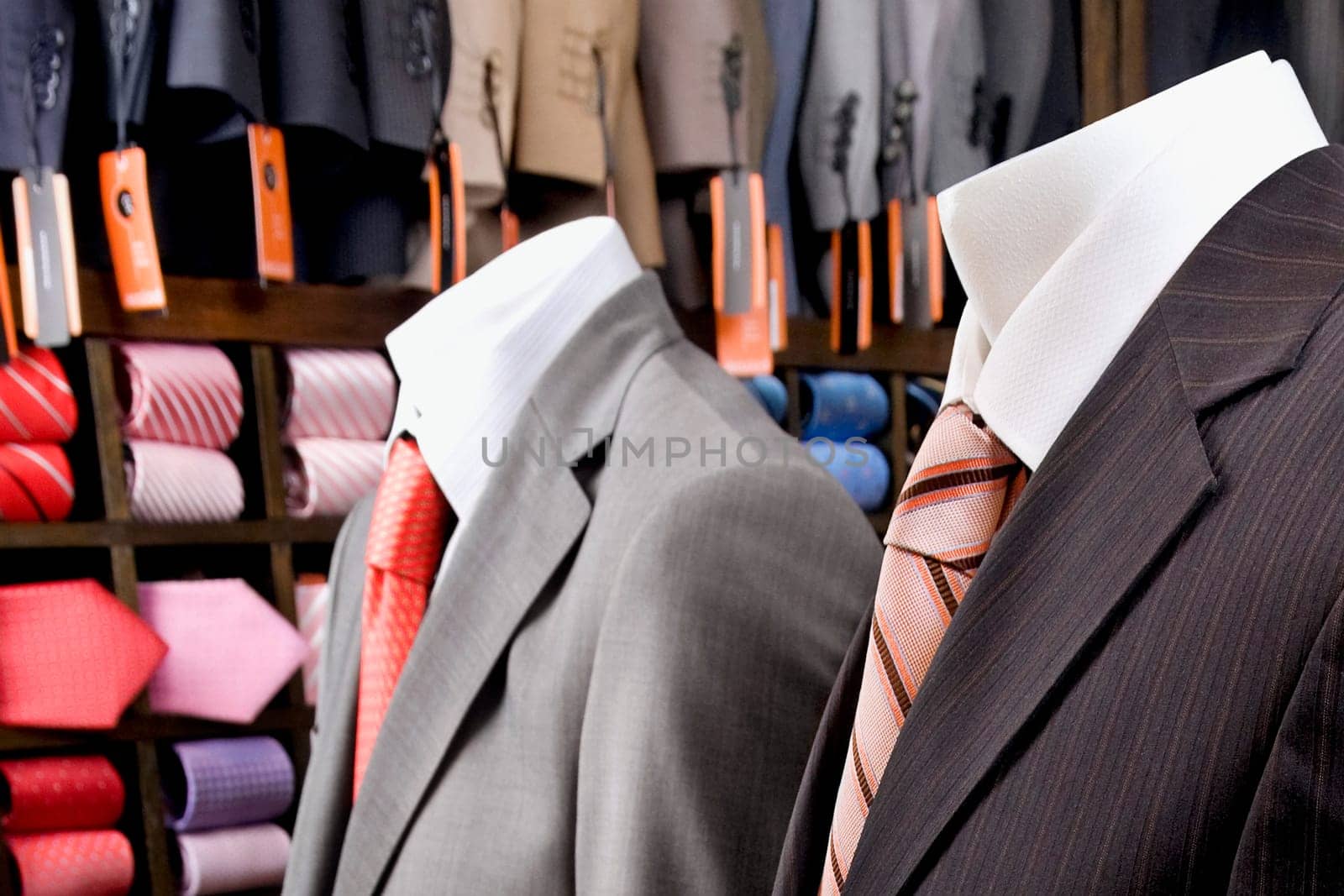 Close_up of mannequins with formal suits in a clothing store