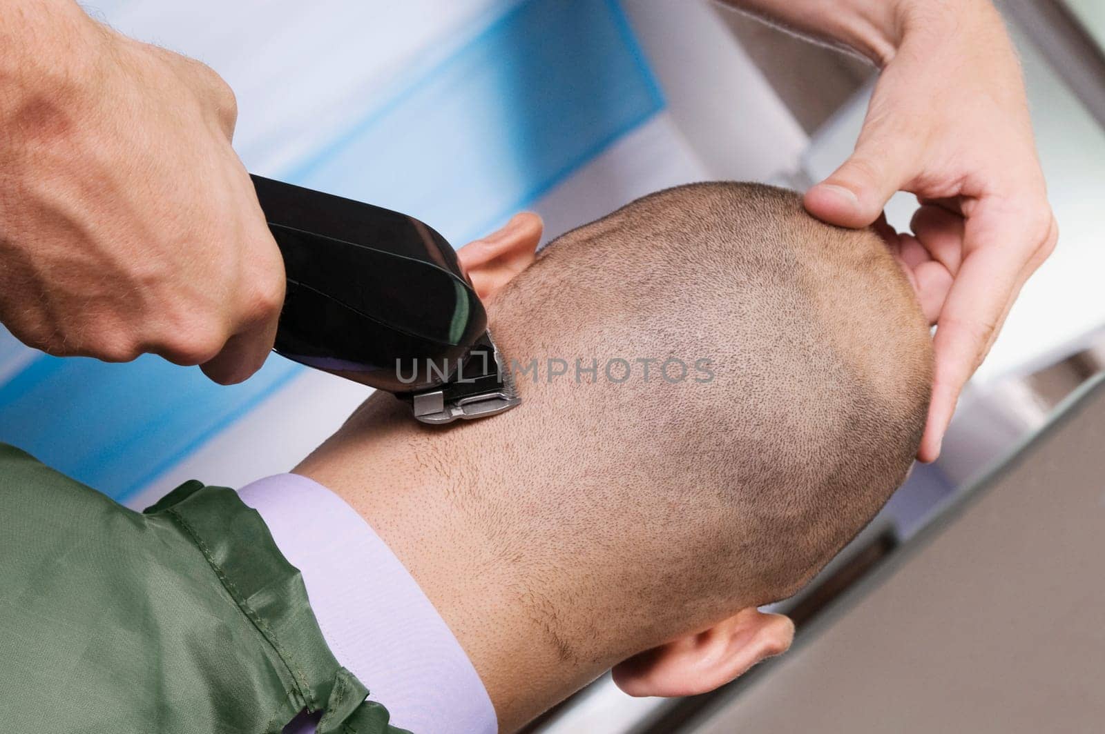 Man receiving a haircut in a salon