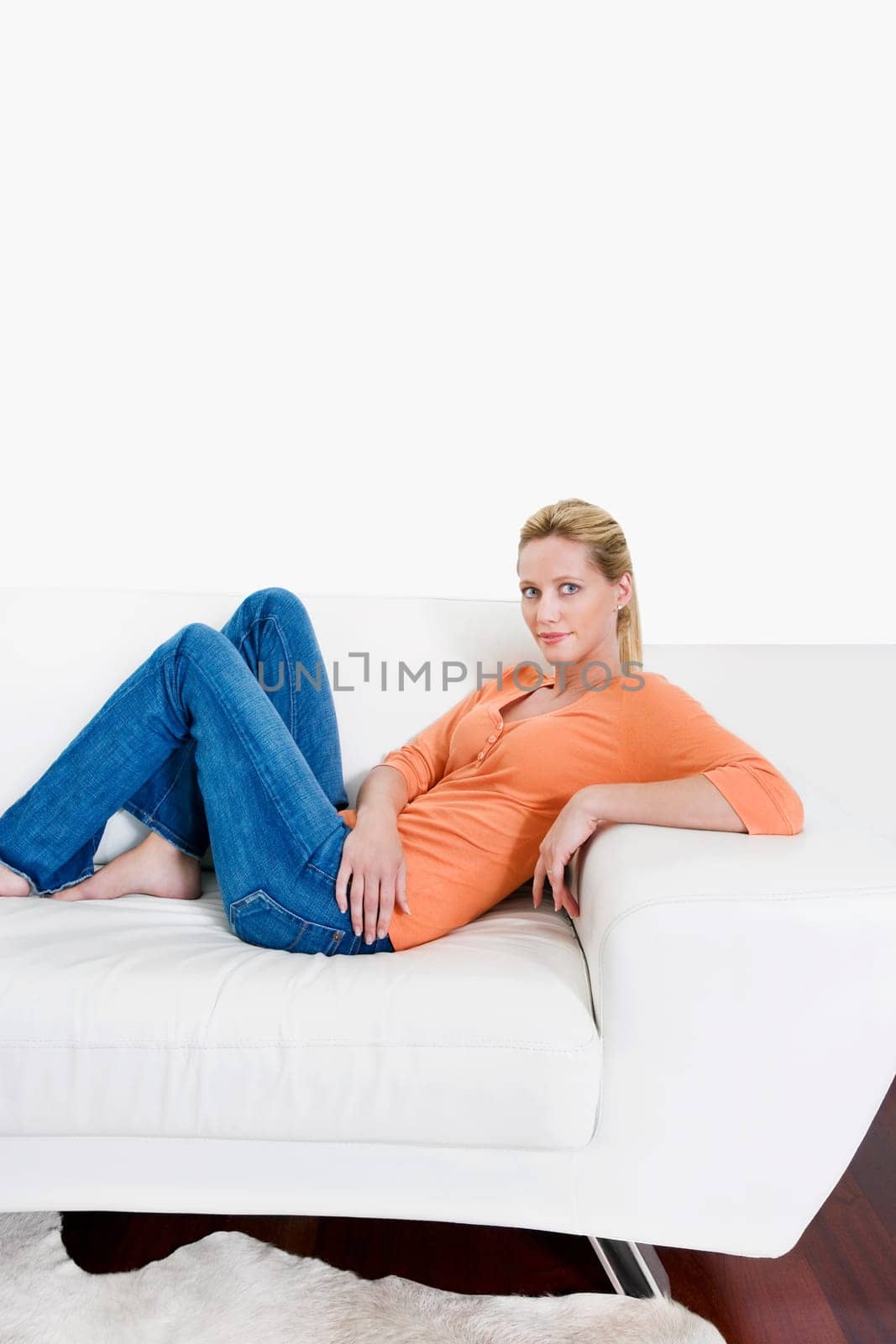 Woman reclining on a couch