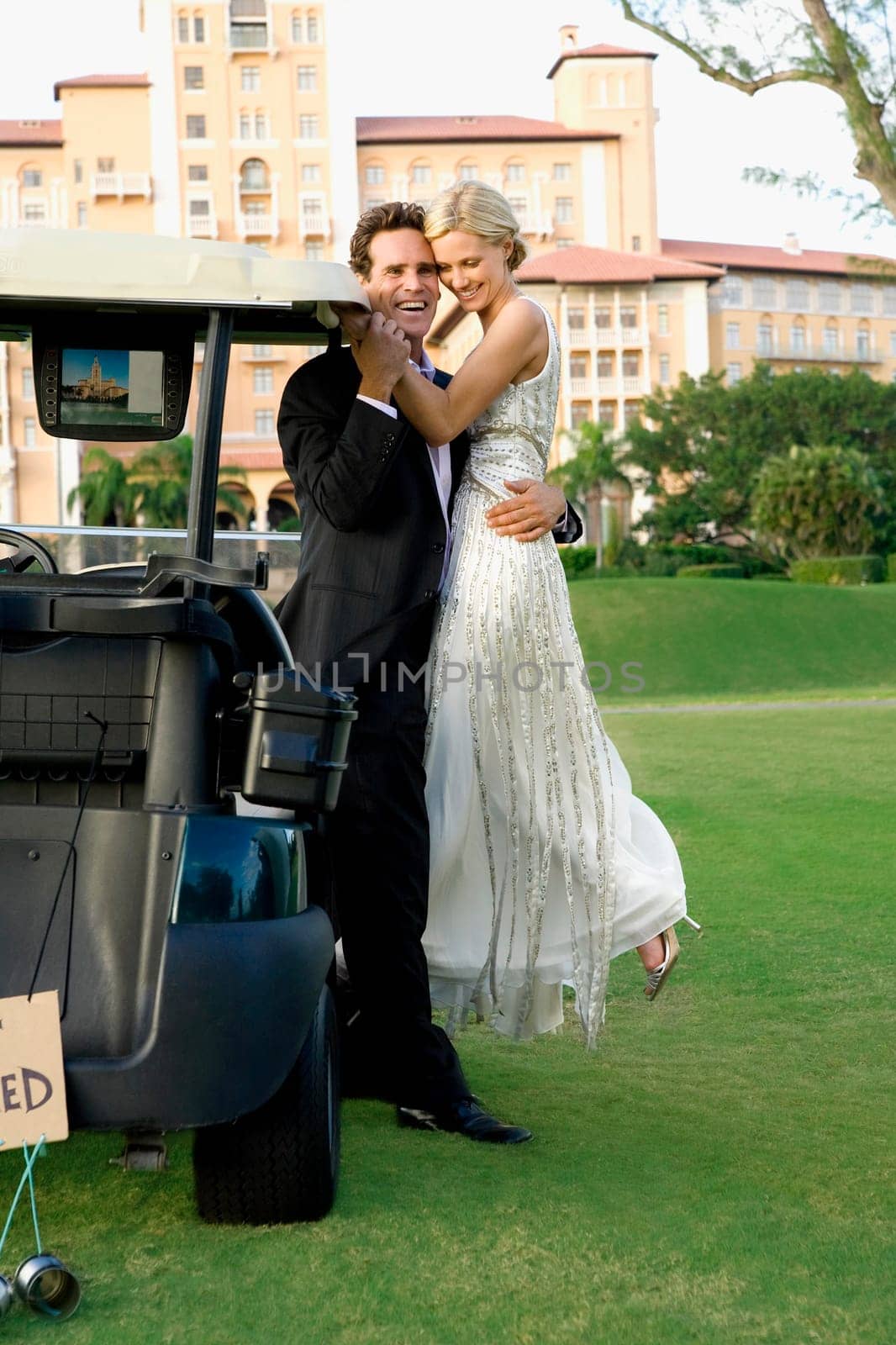 Couple romancing in a golf course and smiling, Biltmore Golf Course, Biltmore Hotel, Coral Gables, Florida, USA