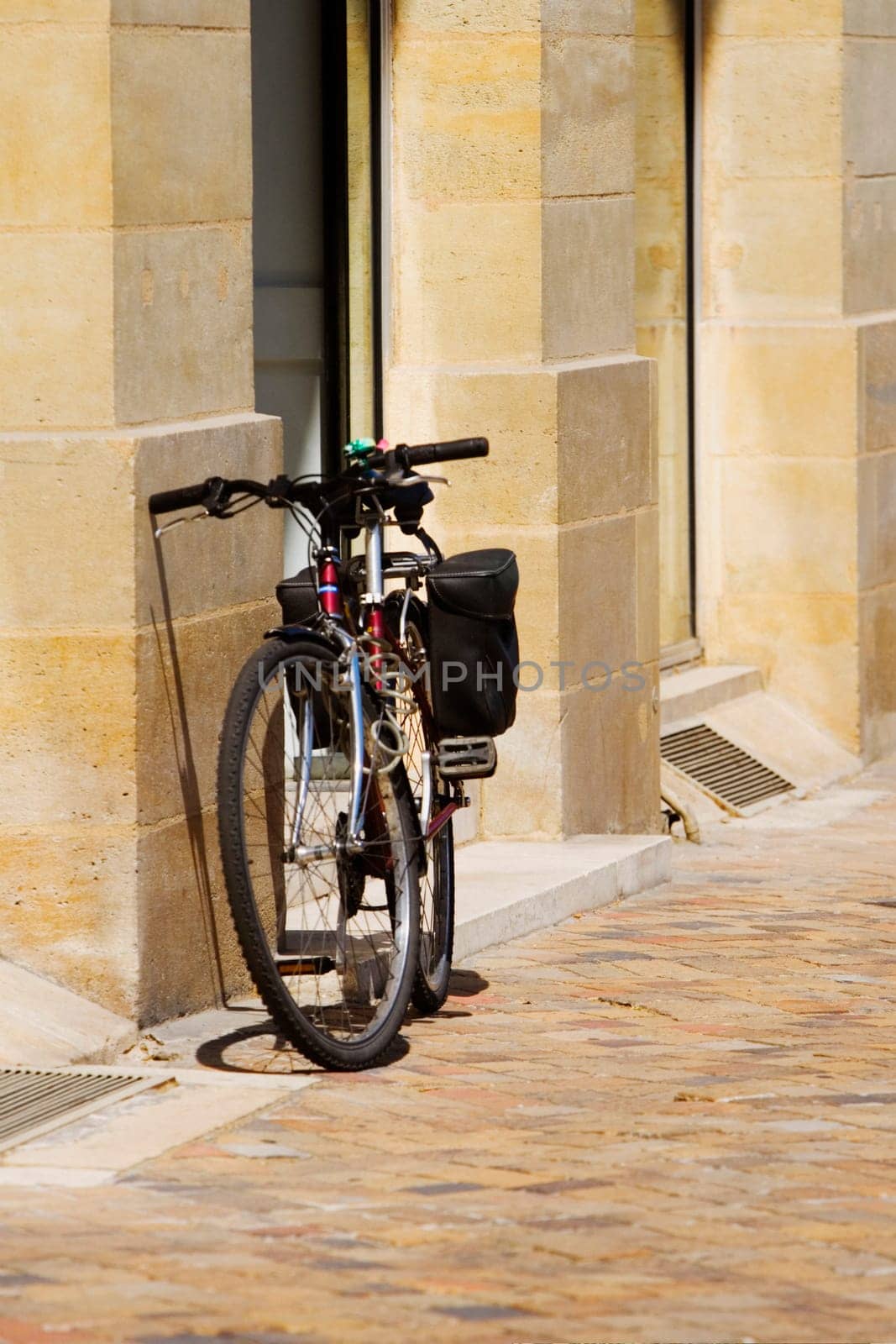 Bicycle parked against a wall