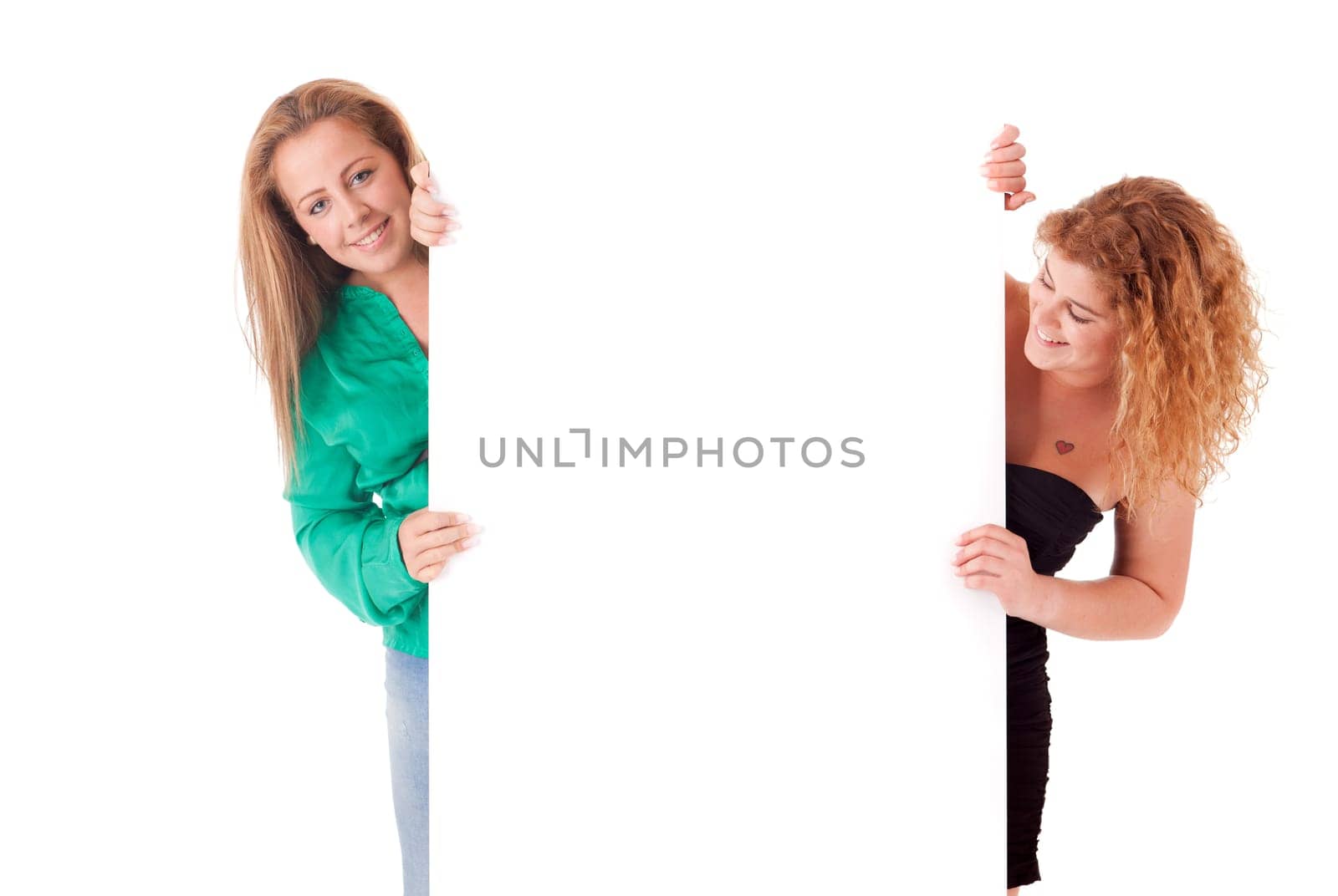 Beautiful young women holding a blank white board