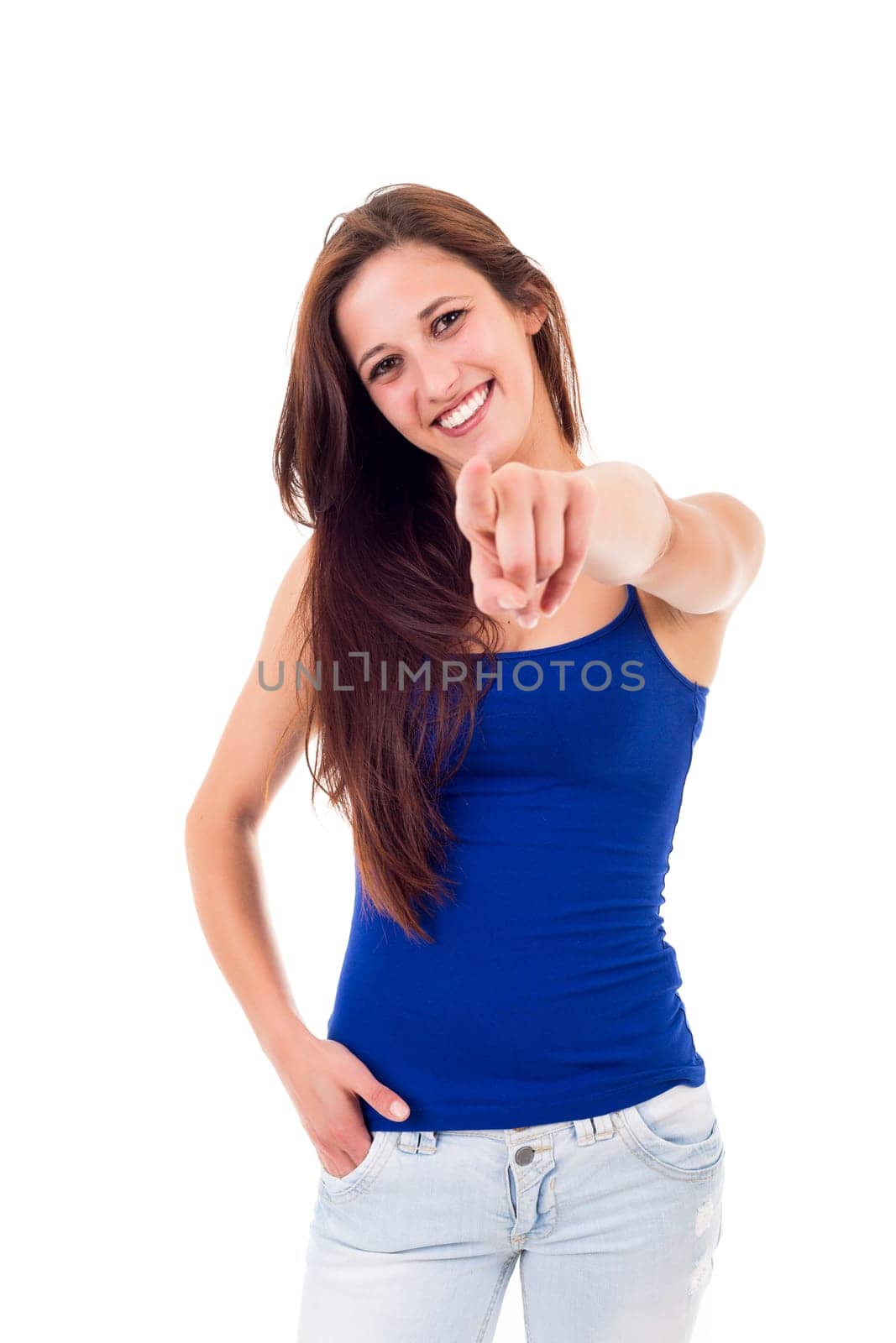 Young beautiful woman pointing at you, isolated over white