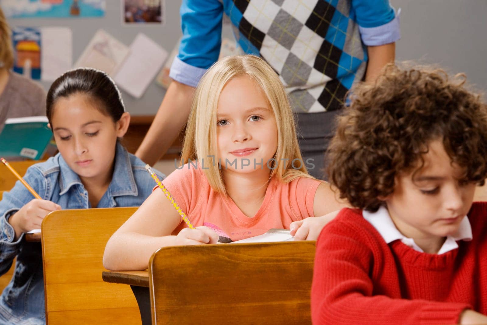 Students with their teacher in a classroom